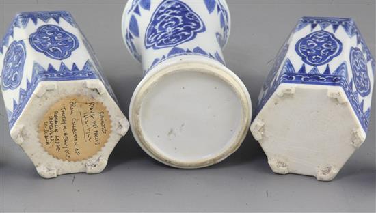 A pair of Chinese blue and white hexagonal jars and covers and a similar beaker vase